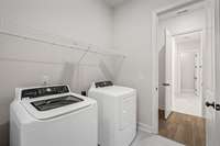 laundry room with access door that leads into the primary bedroom closet for easy access to the laundry.