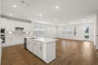 Open concept main living area with kitchen, dining room and family room!