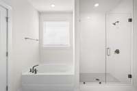 Soaking tub and shower with frameless shower door, tile pan and tiled to the ceiling!