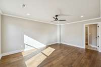 Large Primary suite with recessed lighting, natural light, and ceiling fan.