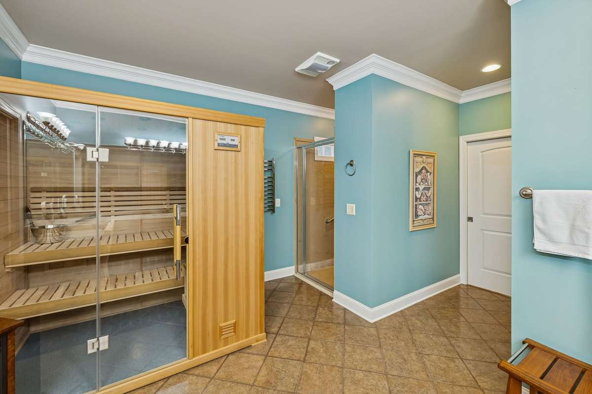 Across from the sauna is a large zero entry shower!
