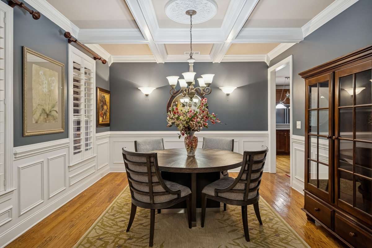 The  coiffered ceiling really sets this dining room off!