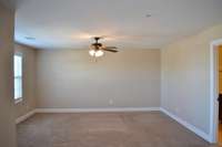 Large master bedroom with balcony off of it.