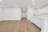 Canyon kitchen and living space. Photo is of similar home, same plan. Colors, interior selections, elevations, garage swing, and upgrades may vary.