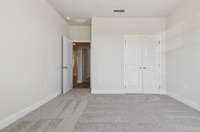 Canyon bedroom 2. Photo is of similar home, same plan. Colors, interior selections, elevations, garage swing, and upgrades may vary.