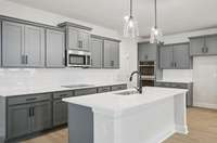 Darlington kitchen. Photo is of similar home, same plan. Colors, interior selections, elevations and upgrades may vary.
