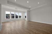 Spacious living room with sun lit morning room.