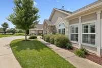 POV: This is the side yard, side-garage entry. Private sidewalk from front door to the garage.