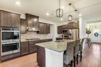 The kitchen is offers stainless appliances and a breakfast bar.
