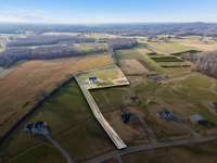 The property is nestled in the very back and is bordered by trees, offering lots of privacy