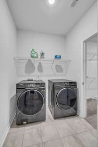 Laundry Room direct access from the Primary Ensuite AND the garage/kitchen hall - now that's a bonus.