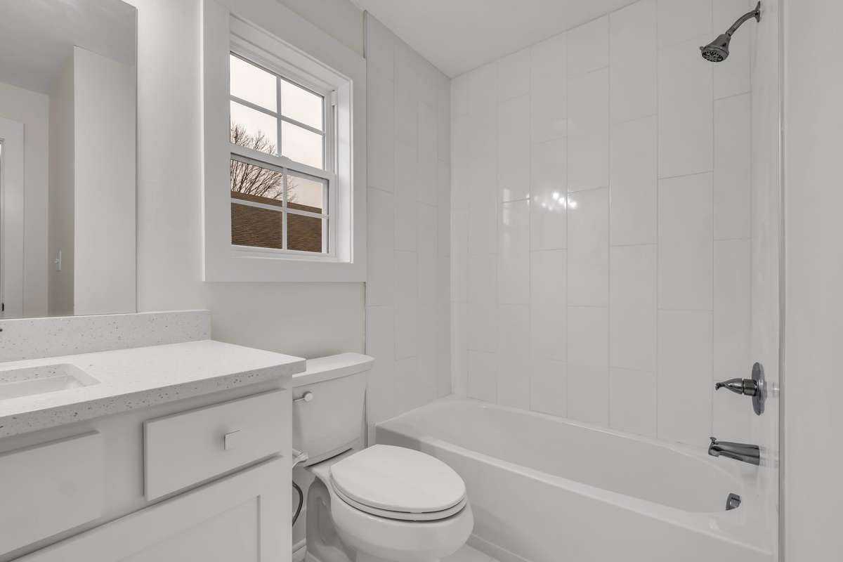 Tile floors in secondary bath.