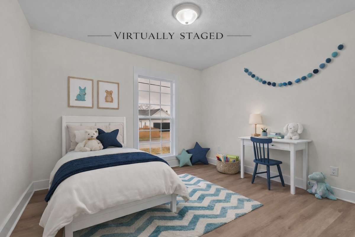Comfortable secondary bedroom with neutral finishes and LVP flooring.