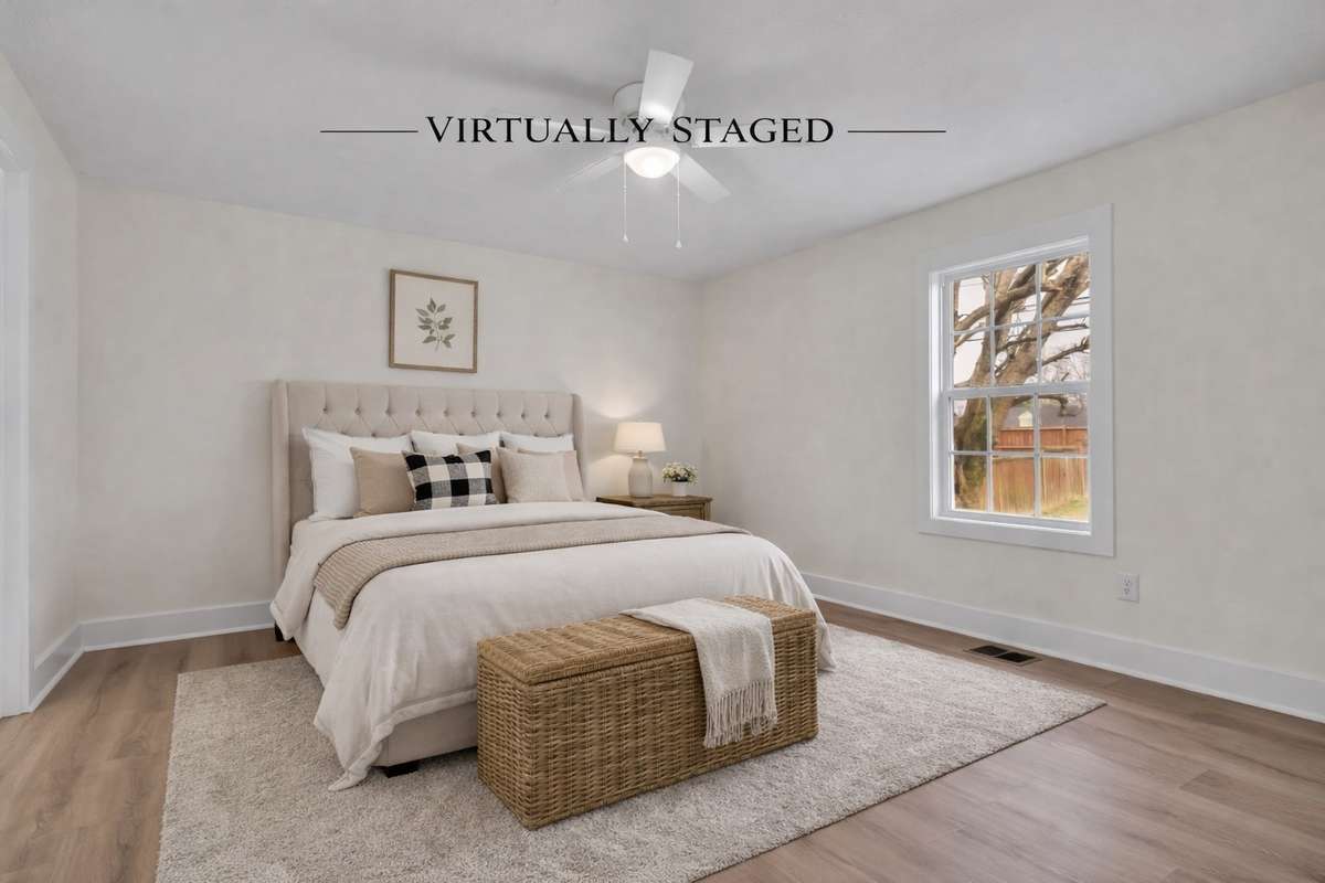 Spacious primary suite with updated finishes and walk-in shower.