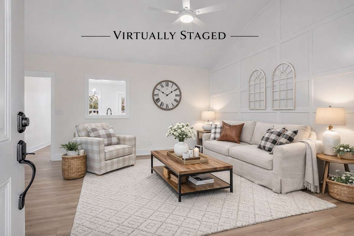 Bright, open living space with luxury vinyl plank flooring throughout — no carpet anywhere.