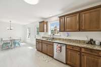Another view of your eat in kitchen with granite countertops, recessed lighting, & over sink window. 68 Taylor Rd. Manchester, TN 37355