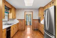 Kitchen has brand new oven and island that can be put in center of kitchen if desired