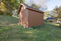 Storage building for storing tools or flower pots