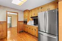 Another view of Kitchen with all the cabinets.  This view shows opening going into formal dinning room . All wood floors