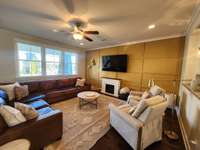 Living room with view of feature wall