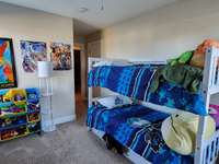 Two windows in bedroom #3 provides natural lighting