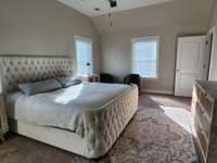 Spacious bedroom with high ceilings