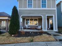 A cozy front porch with a swing!