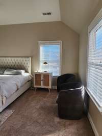 Cozy seating area in primary bedroom