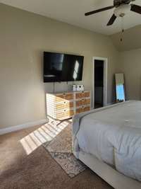 Natural light coming through in primary bedroom
