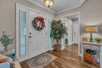 Beautiful entry foyer with hardwood flooring.