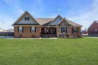 Stunning 3 BR/2 bath custom brick/stone home on a large corner lot in Manchester!