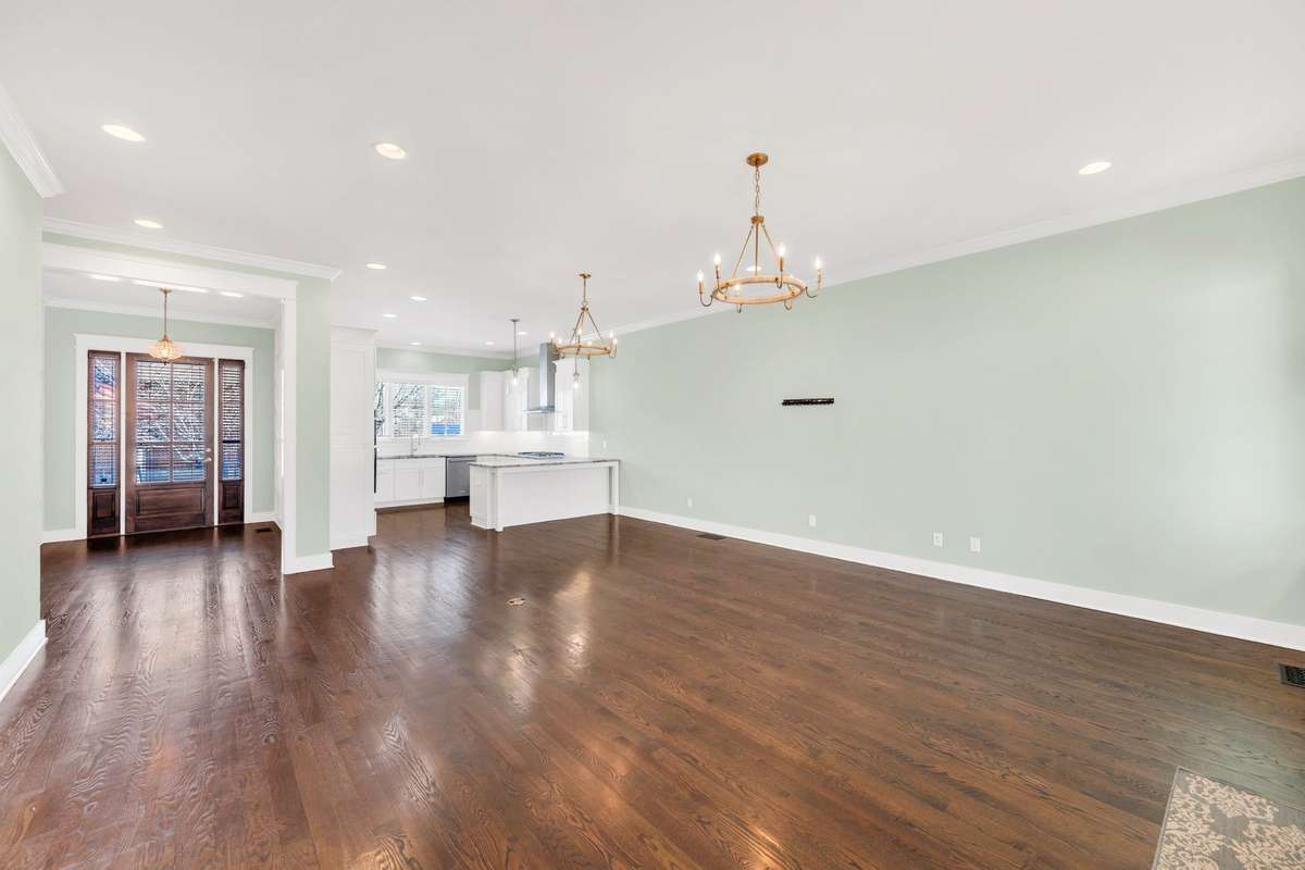 entry foyer open to living area and kitchen
