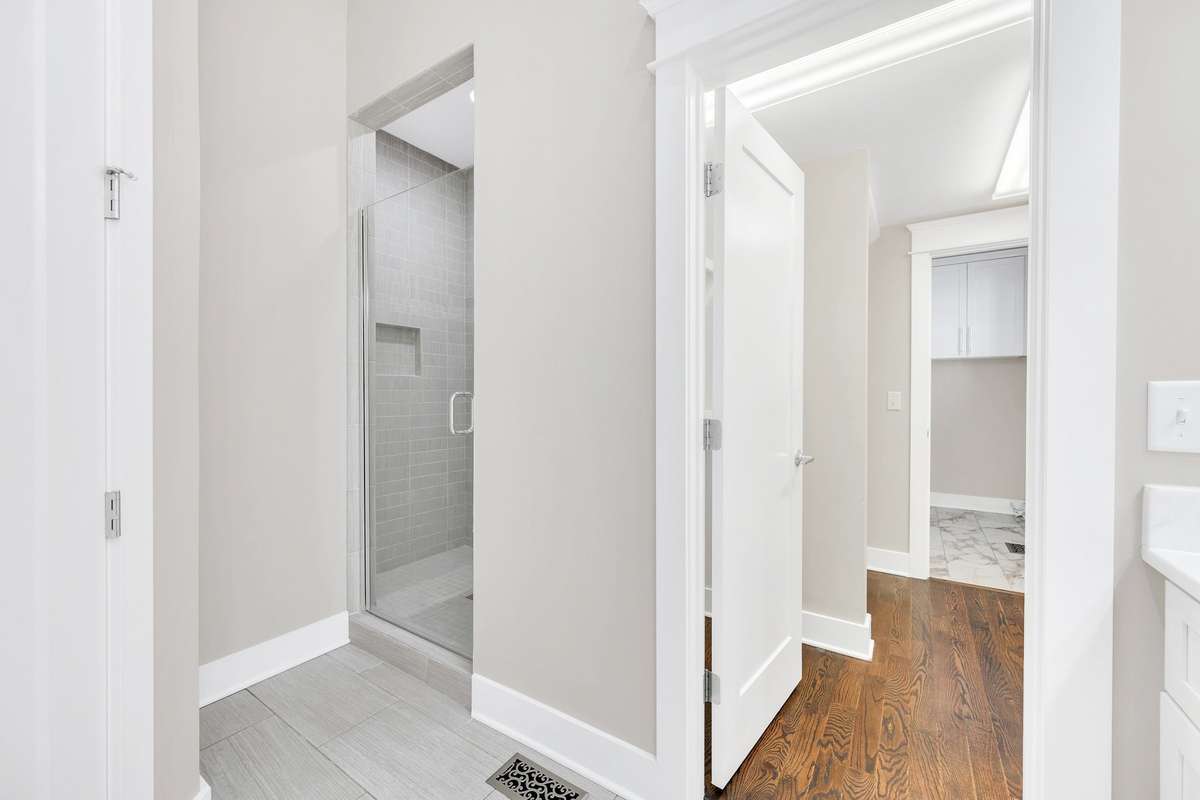 Full bath leads to large walk-in closet