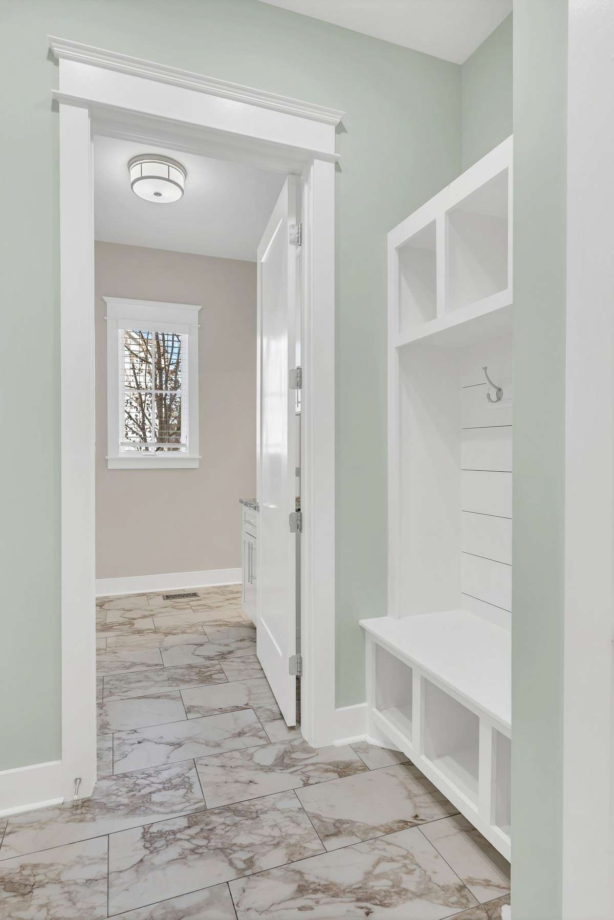 Space to hang book bags, coats, etc when you enter from garage