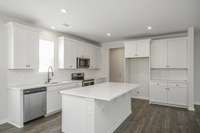 Ample storage and serving space! SS appliances, tile backsplash, and granite or quartz countertops included in your kitchen. Double wall ovens or wall oven/microwave with wood hood optional!  **All photos are of a previously constructed Covington flo