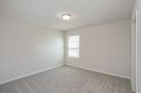 GREAT space in your secondary bedrooms upstairs. All 3 have nice closet space!  **All photos are of a previously constructed Covington floorplan.**