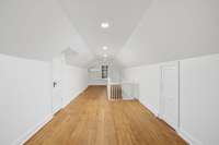 Newly finished hardwood floors and generous ceiling height are 2 of the features of this room