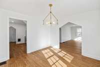 Another view of the dining room leading into the kitchen for easing entertaining