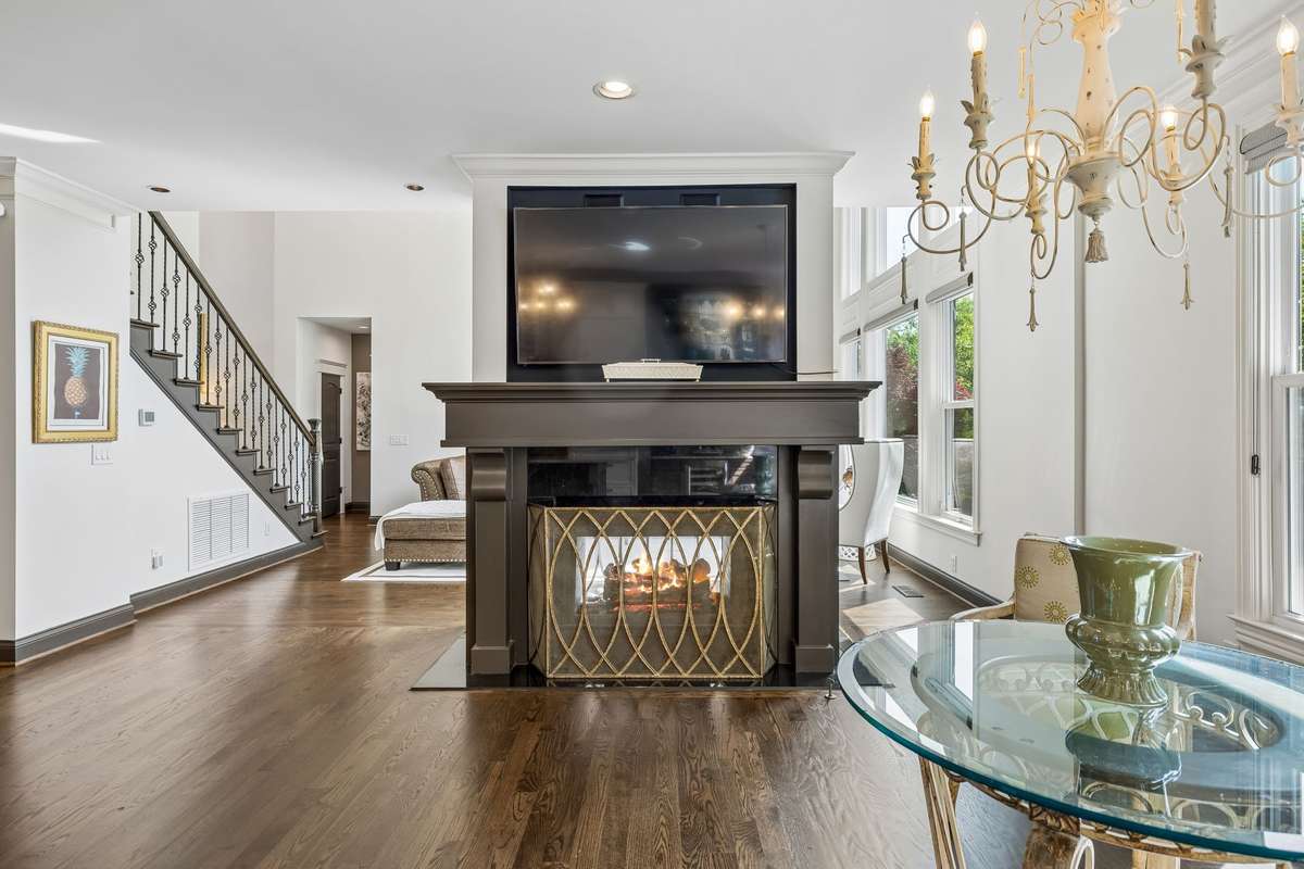 Second TV above fireplace conveys with the house.