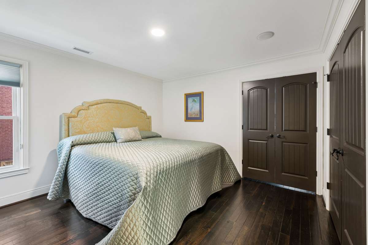 Secondary bedroom #2 has a custom double door closet with built-ins. Double doors lead to the flex room.