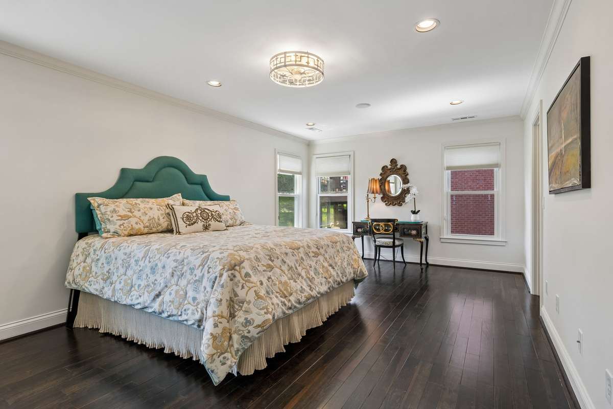 Three secondary bedrooms upstairs, two full bathrooms, and a flex room. Bedroom at top of stairs to the left is large enough to be a second primary. Two double door closets and a walk-in closet off bathroom with custom built-ins.