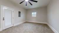 Love the large baseboards and oversized ceiling fan in the bonus space with tall ceilings.  Very versatile room.