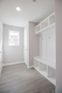 EXAMPLE>>>Mudroom off the Garage with a Built-in Hall Tree and a Closet!