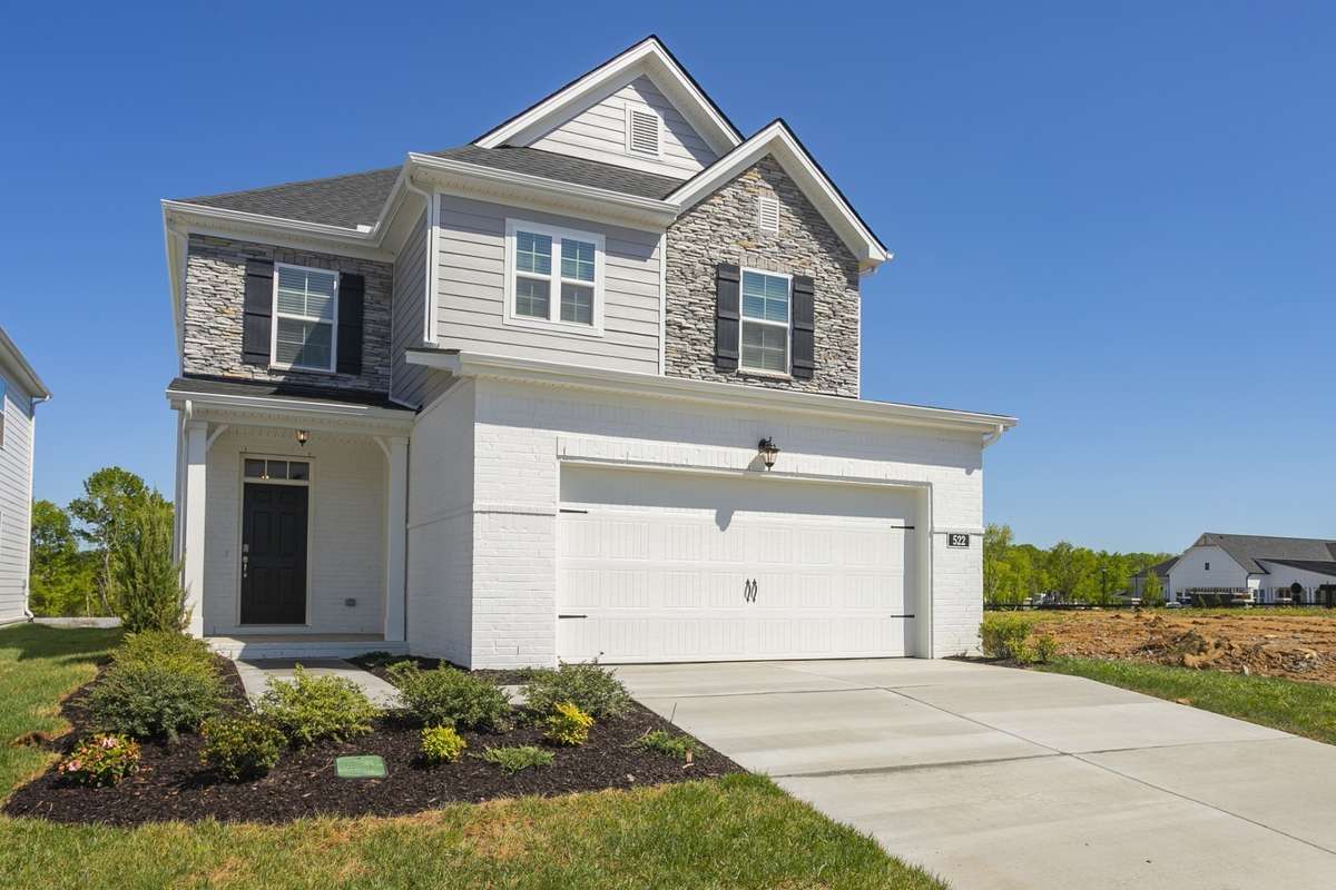 Will be the Farmhouse Elevation... **All photos are of a previously constructed Covington floorplan.**