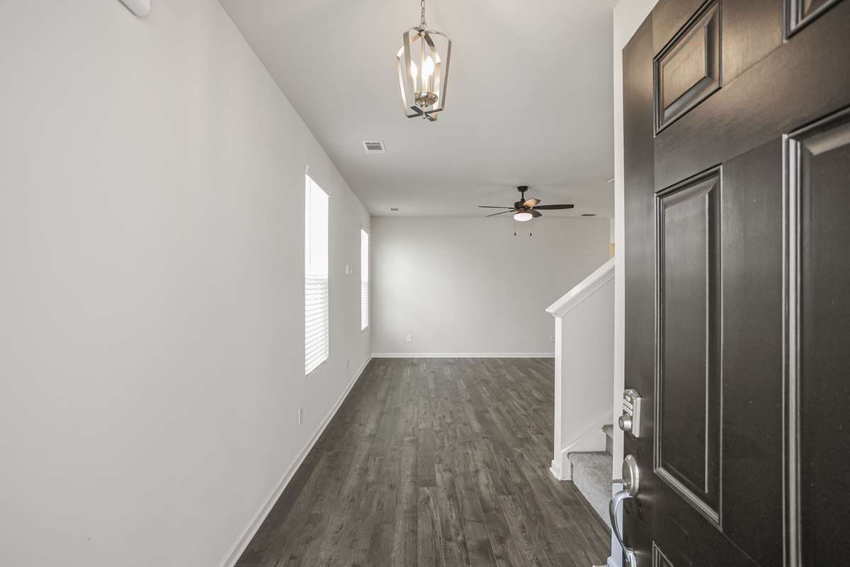 Foyer entry with coat closet and stairs tucked away. **All photos are of a previously constructed Covington floorplan.**