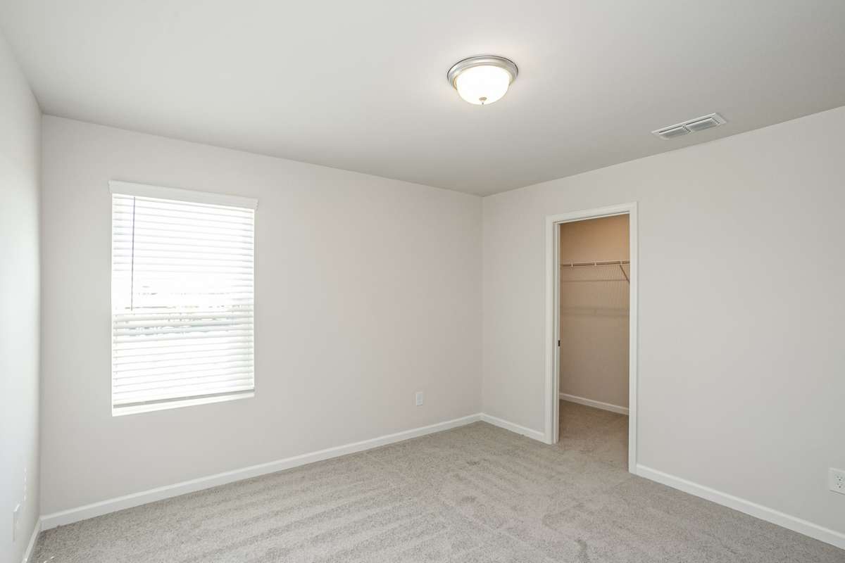 GREAT space in your secondary bedrooms upstairs. All 3 have nice closet space! **All photos are of a previously constructed Covington floorplan.**