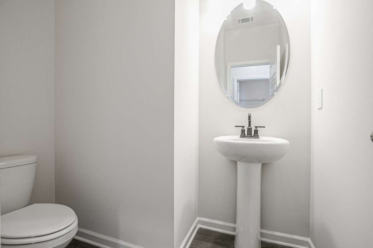 Powder room downstairs off main living area for guests. **All photos are of a previously constructed Covington floorplan.**