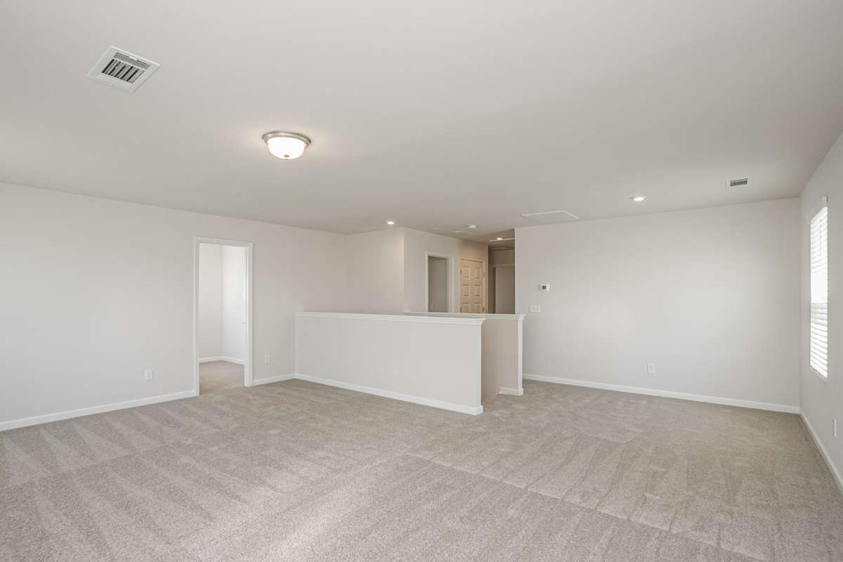 HUGE bonus room upstairs with large walk-in storage closet.  This home will have iron railing on stairs. **All photos are of a previously constructed Covington floorplan.**