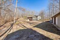 Front of the home and 3 car detached garage.