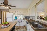 Kitchen with pass through to family room.